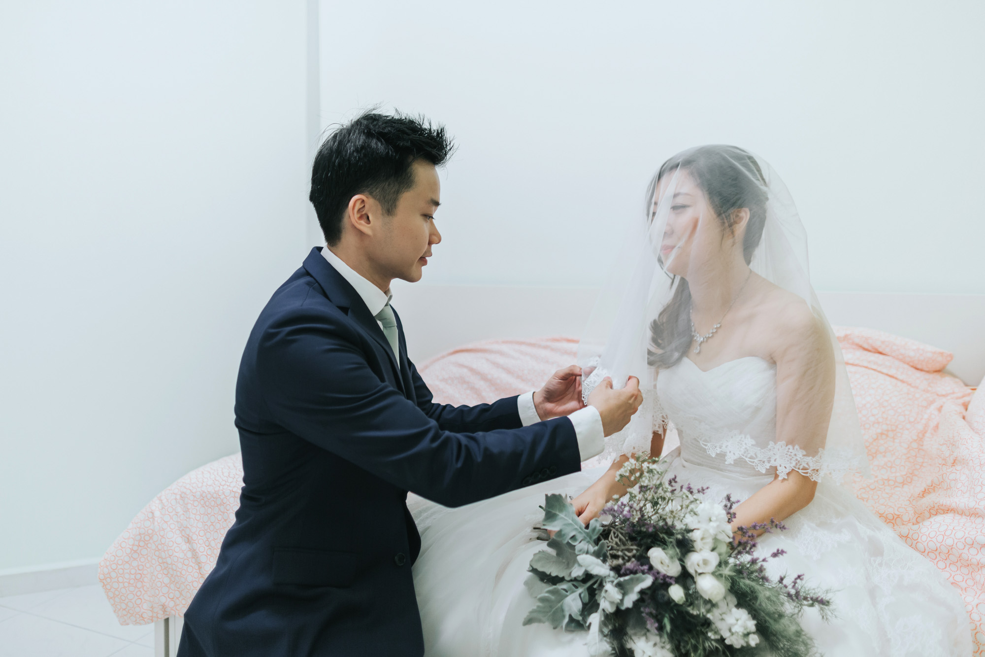 groom unveiling the bride
