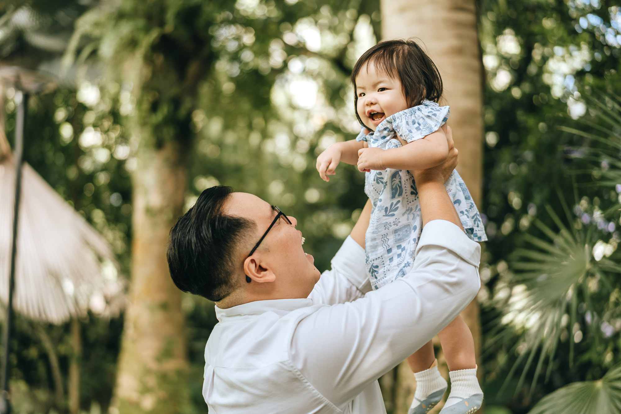 holding his daughter high!