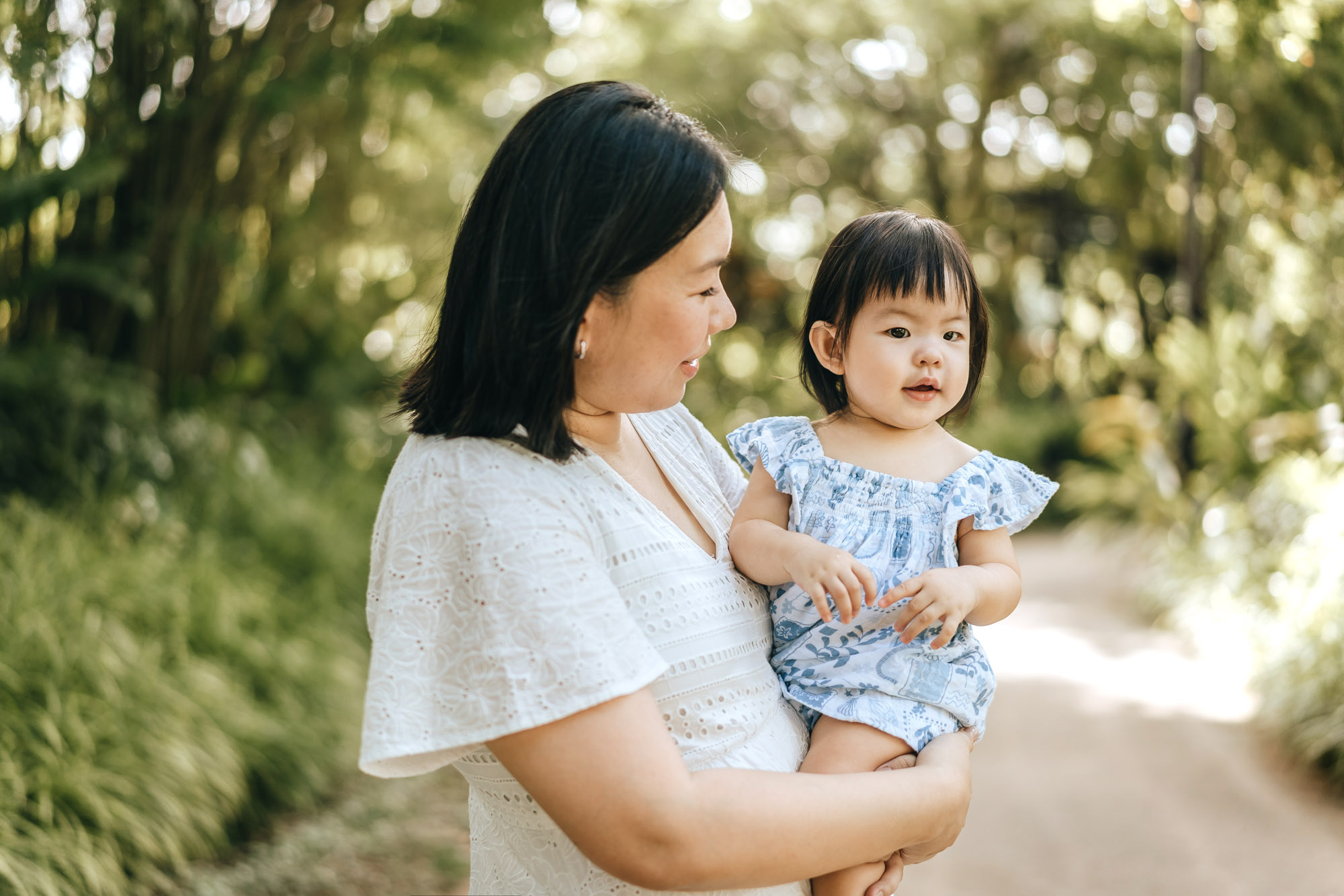 Happy mommy holding happy daughter.