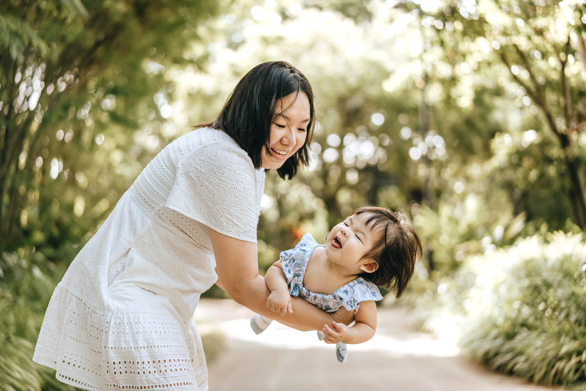 Mommy holding her daughter.