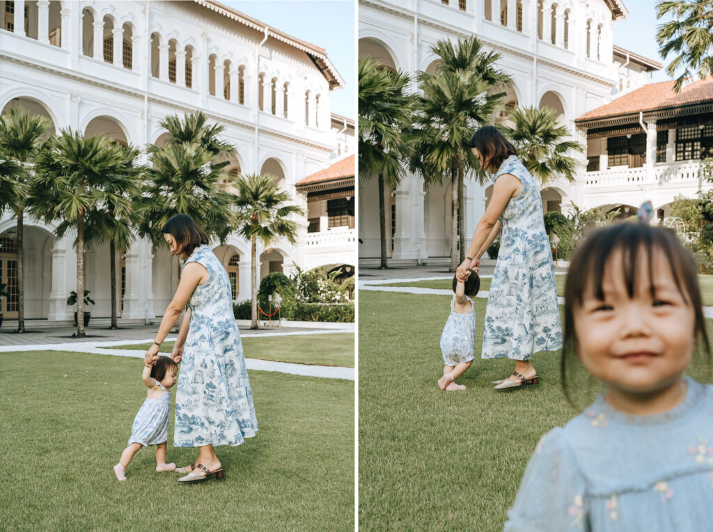 mother and baby dancing at the Raffles Hotel Lawn.