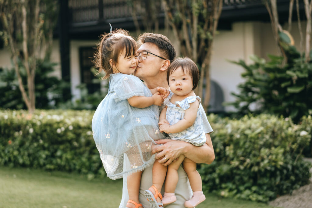 Photo of a father and his beautiful babies.