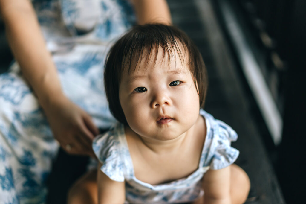 closeup photo of a baby taken during their family photo shoot at the Raffles Hotel.