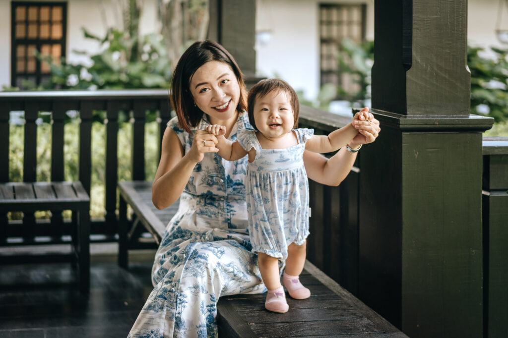 Mother and baby posing for the camera during their photo shoot at the Raffles Hotel.