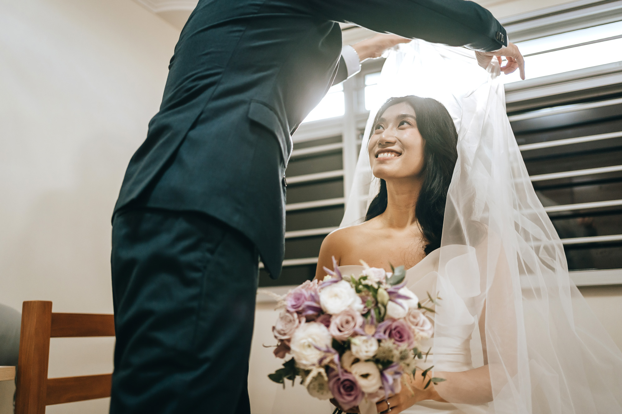 the groom unveils his bride