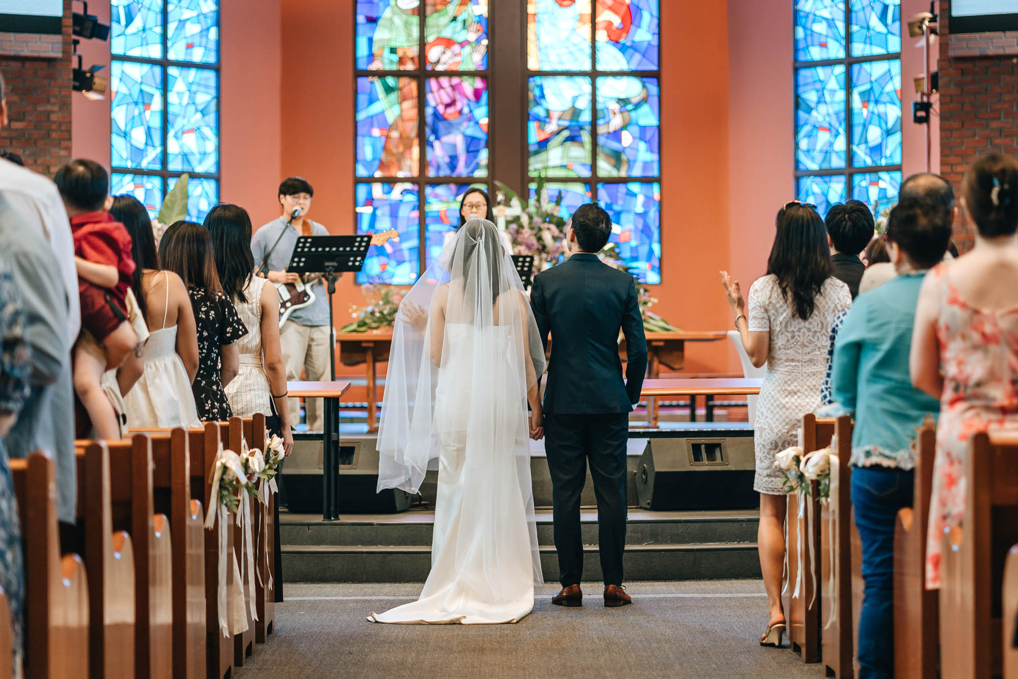the couple singing during the ceremony