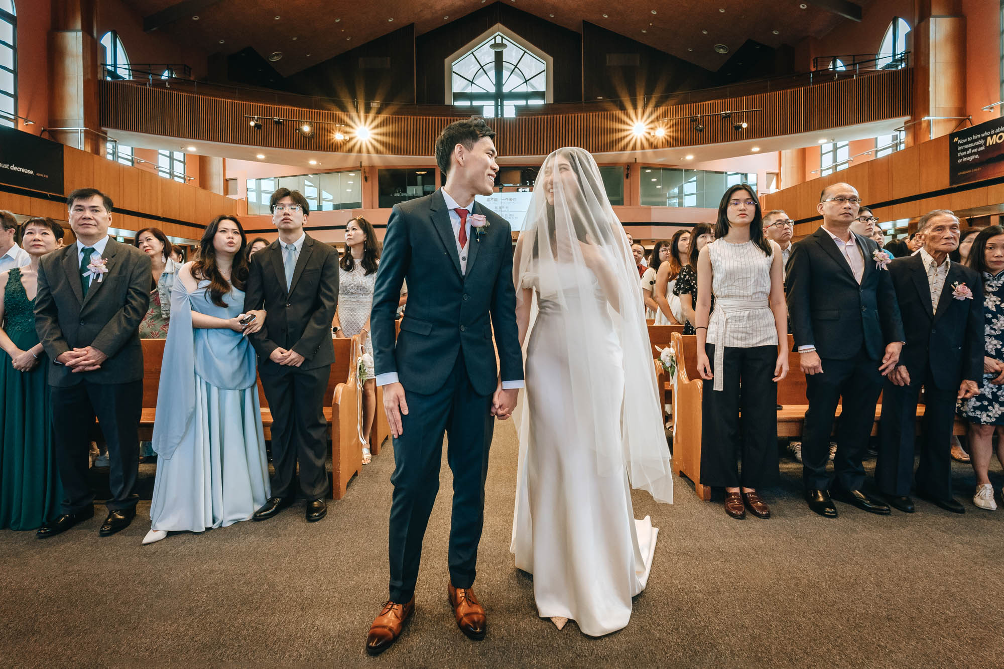 the bride and groom shares a smile