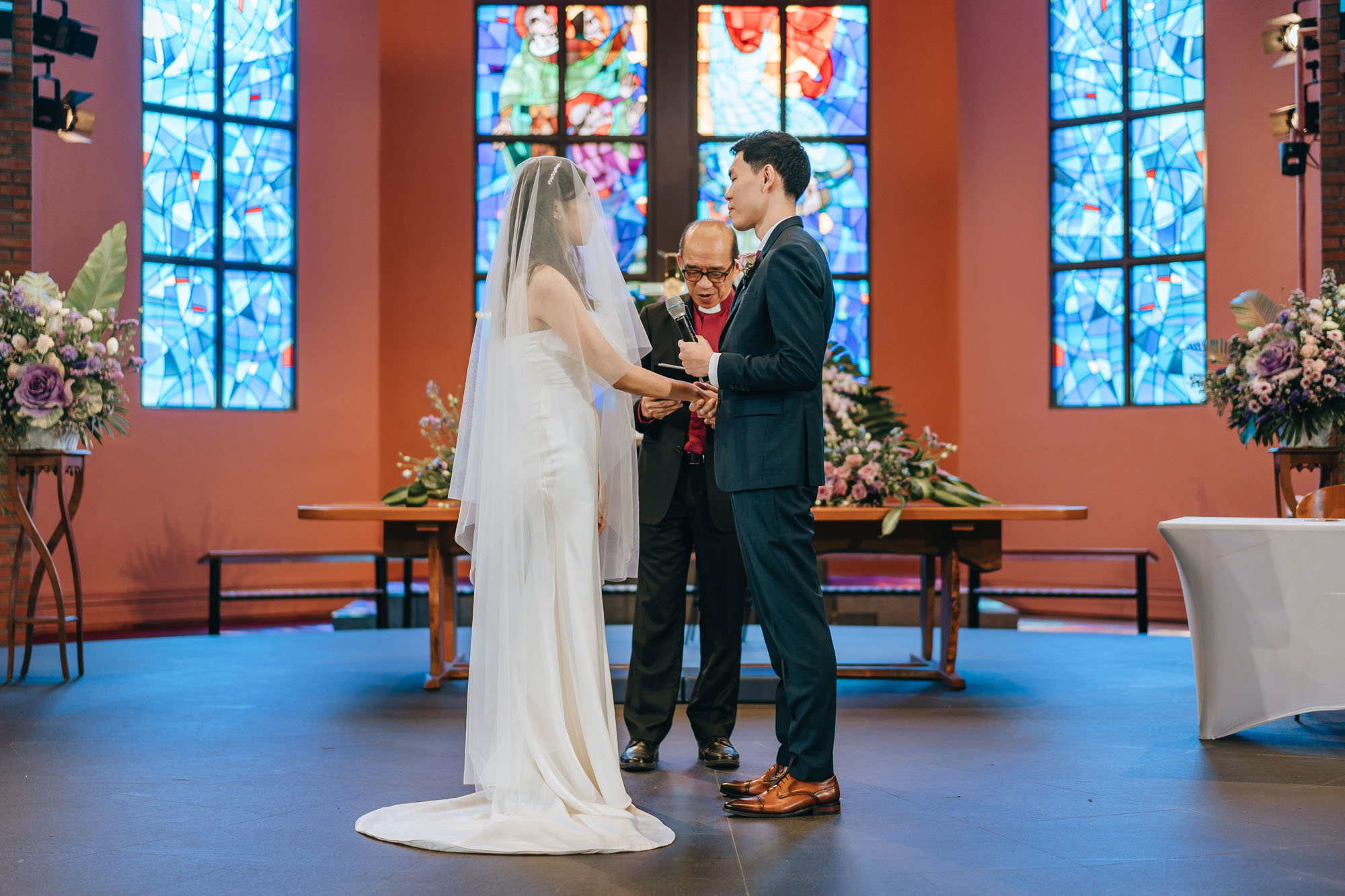 the wedding couple exchanging vows