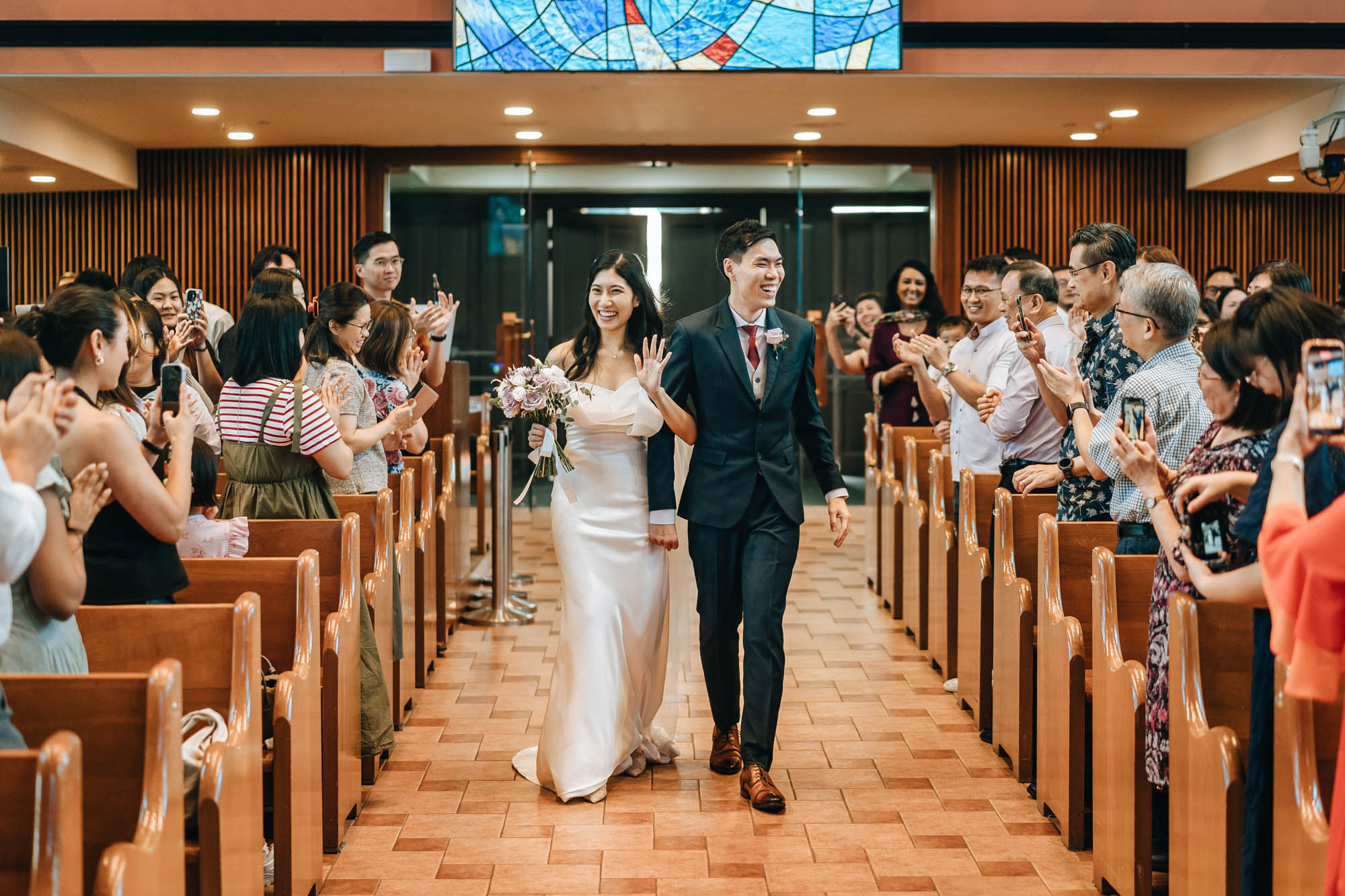 the newly weds re-entering the church as husband and wife