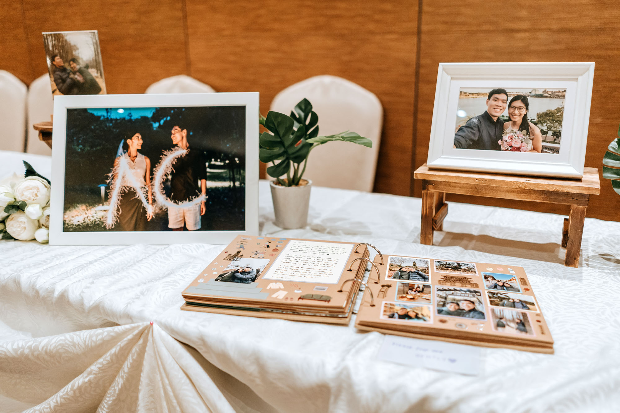 entrance to the ballroom decorated with photos of the wedding couple