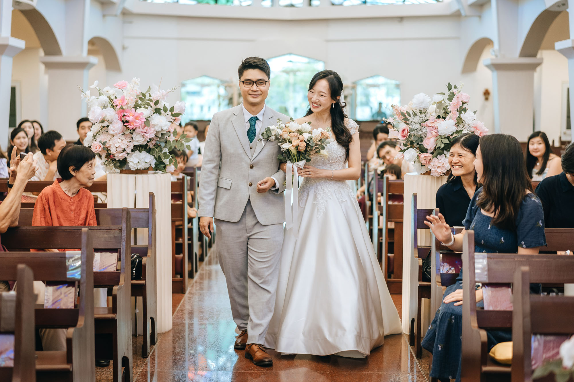 the couple marches down the aisle