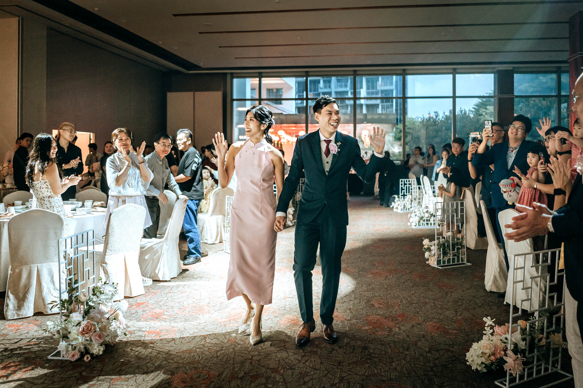 the wedding couple makes their grand entrance into the ballroom at chui huay lim club