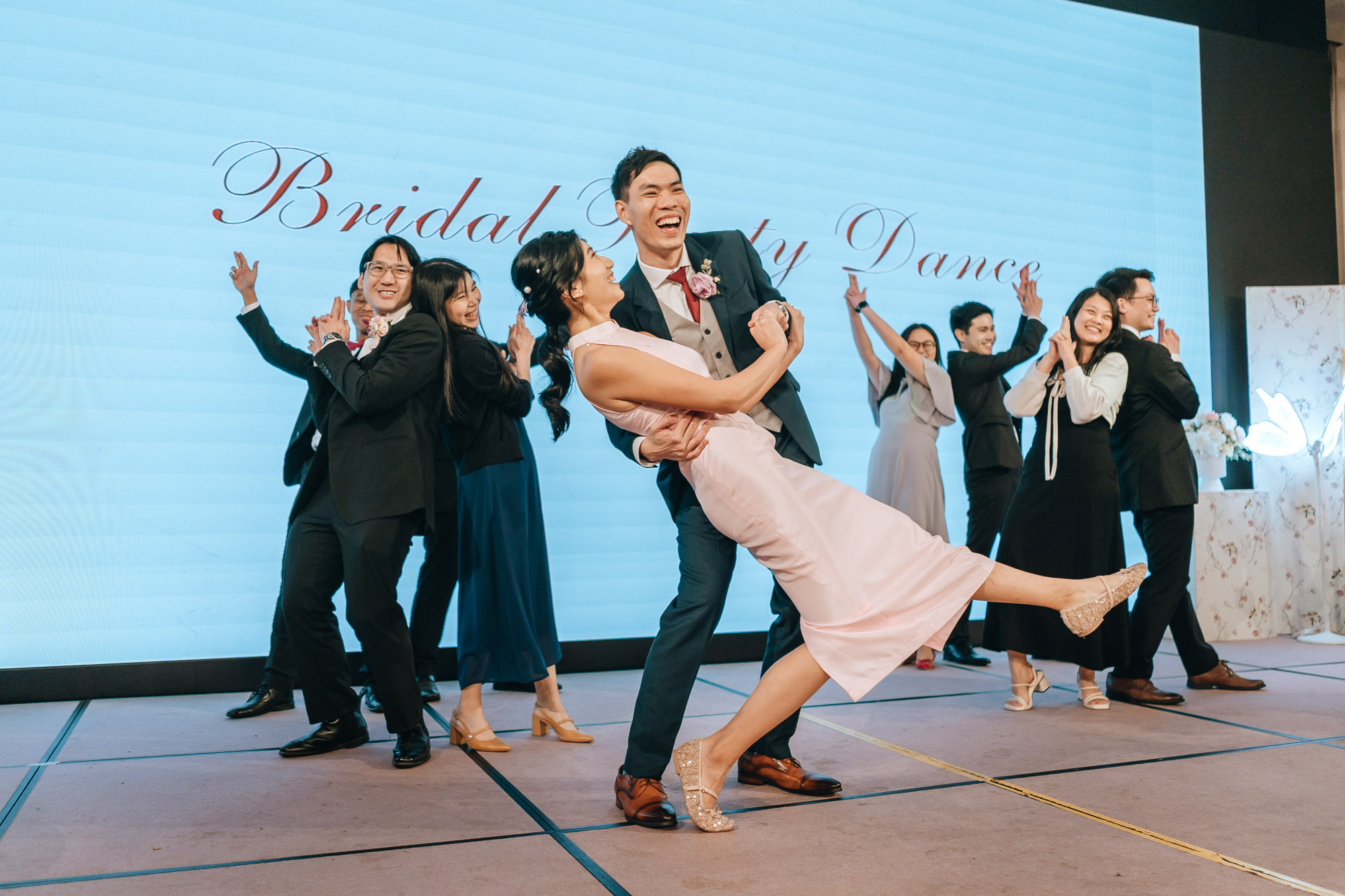 the bridal party poses during the dance