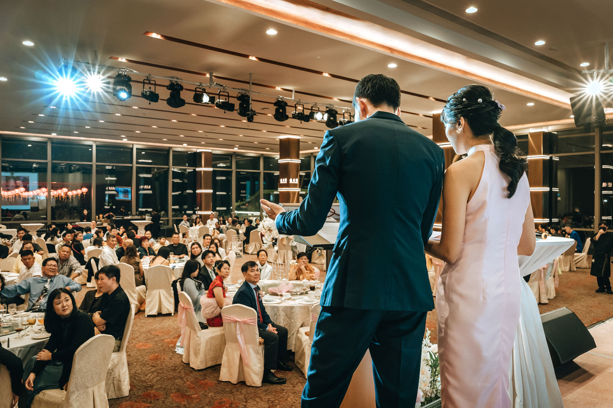 the wedding couple giving thir thank you speeches during the banquet