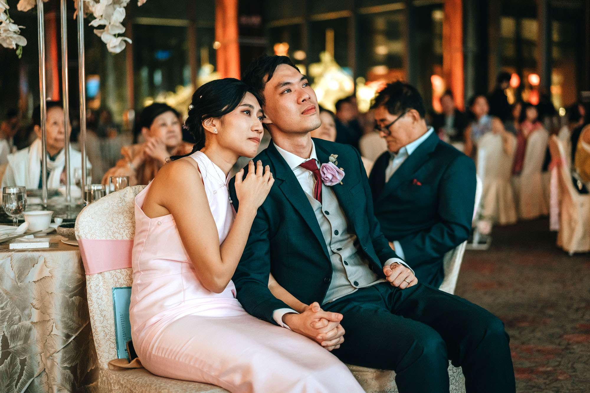 wedding couple watching the same day edit video