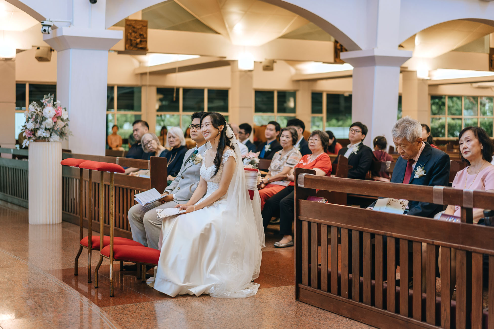 bride smiles as she listens to the message