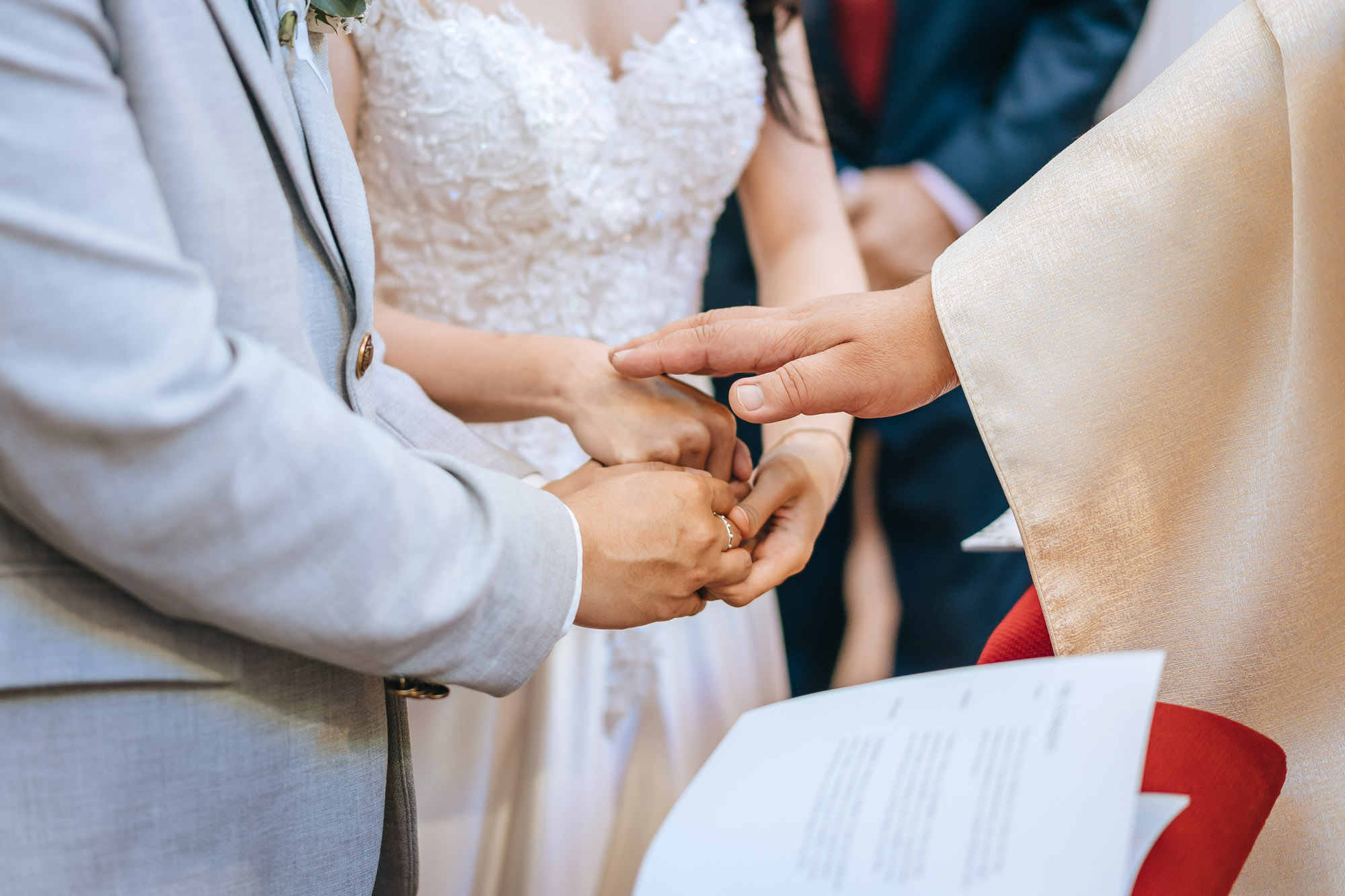 the priest blesses the couple